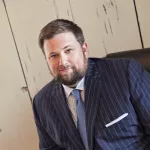 Justin K. Thomas