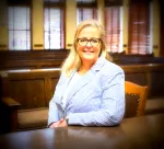 Ms. Justine M. Daly