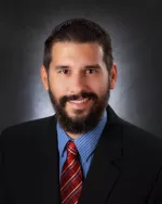 Charles M. Budde, Esq.