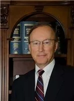 John E. Suthers