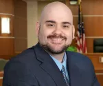 Douglas M. Greene, Esq.